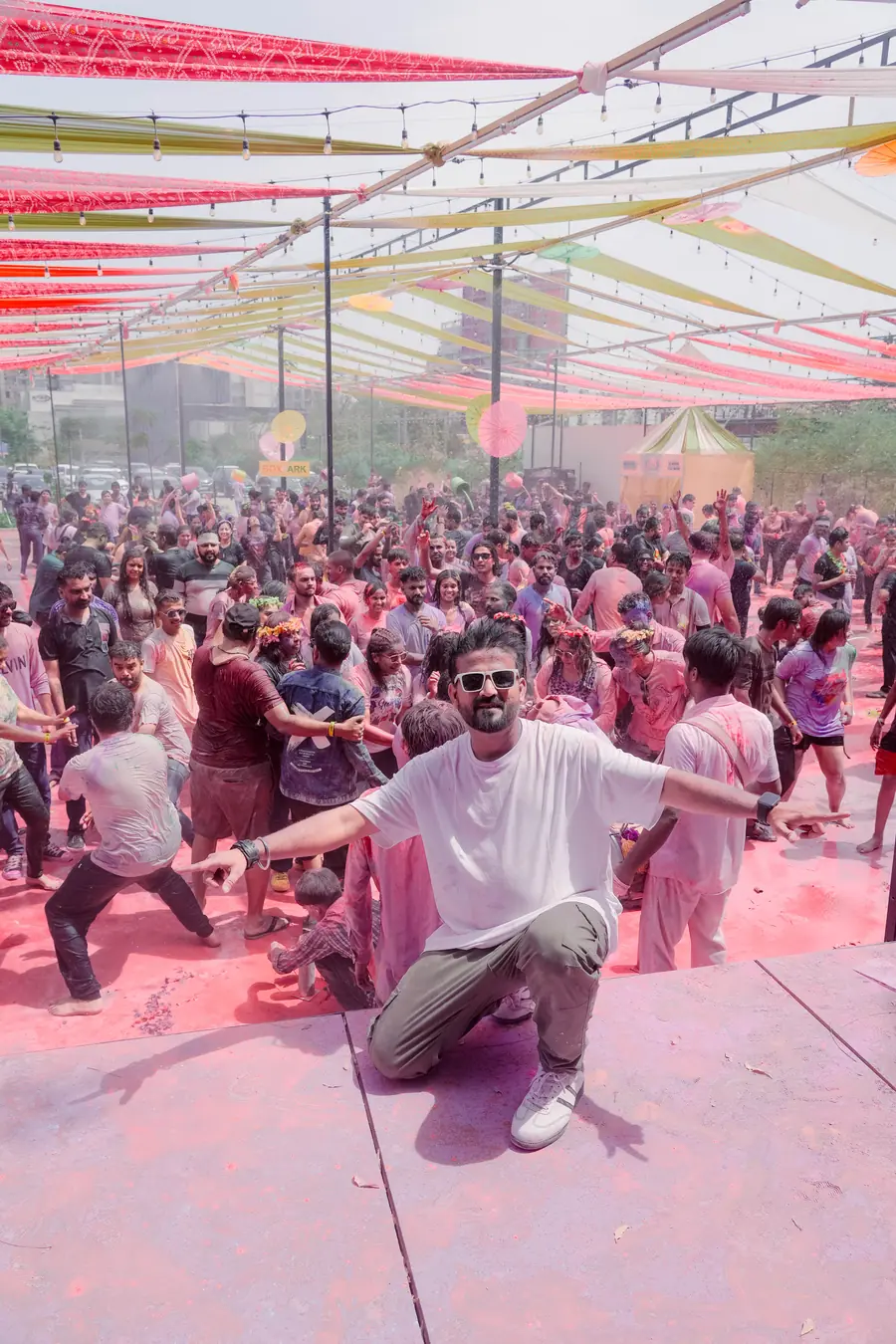 DJ Nikhil posing in front of the Go Pagal Season 7 Holi crowd at Box Park Ahmedabad
